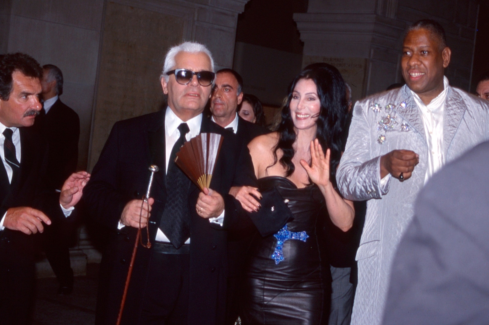 Images may contain Karl Lagerfeld Andr Leon Talley Cher Rajiv Gandhi Gandhi Gandhi Gandhi Gandhi Gandhi Gandhi Coat and Formal