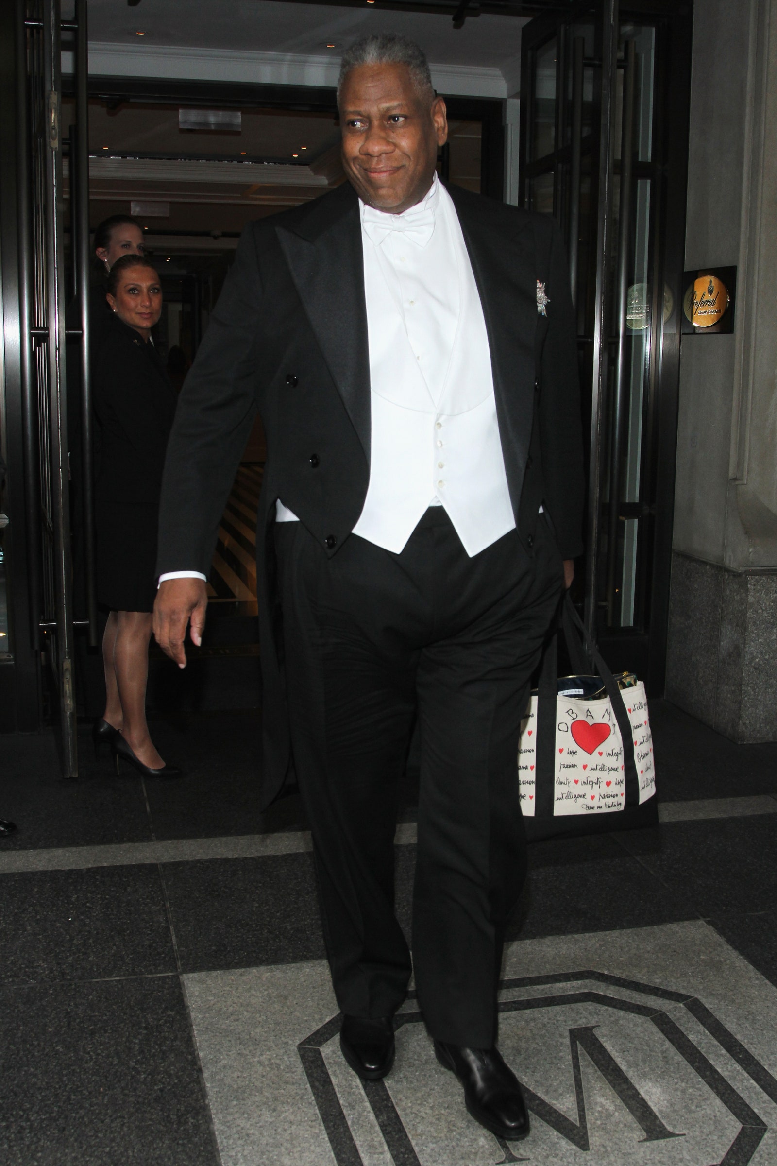 Images may contain Andr Leon Talley blazer, formally wearing jacket suit tuxedo accessories and bags