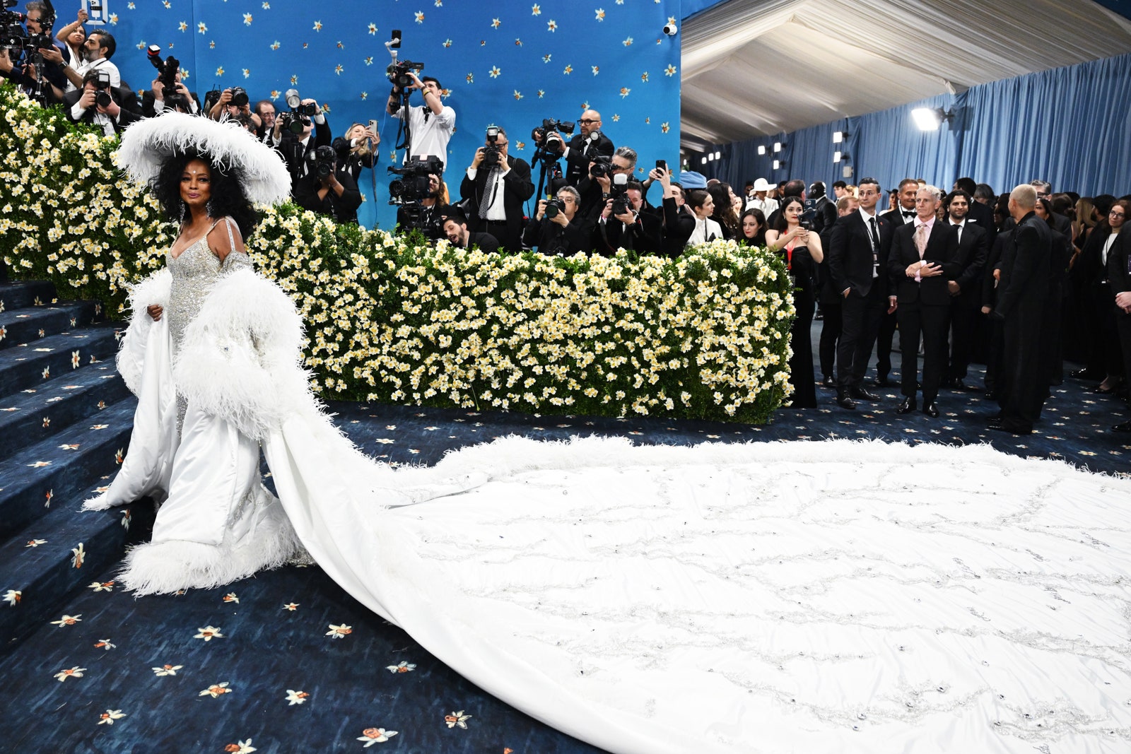 Images may contain Diana Ross Walter Jones adult wedding hat camera electronics and formal wear