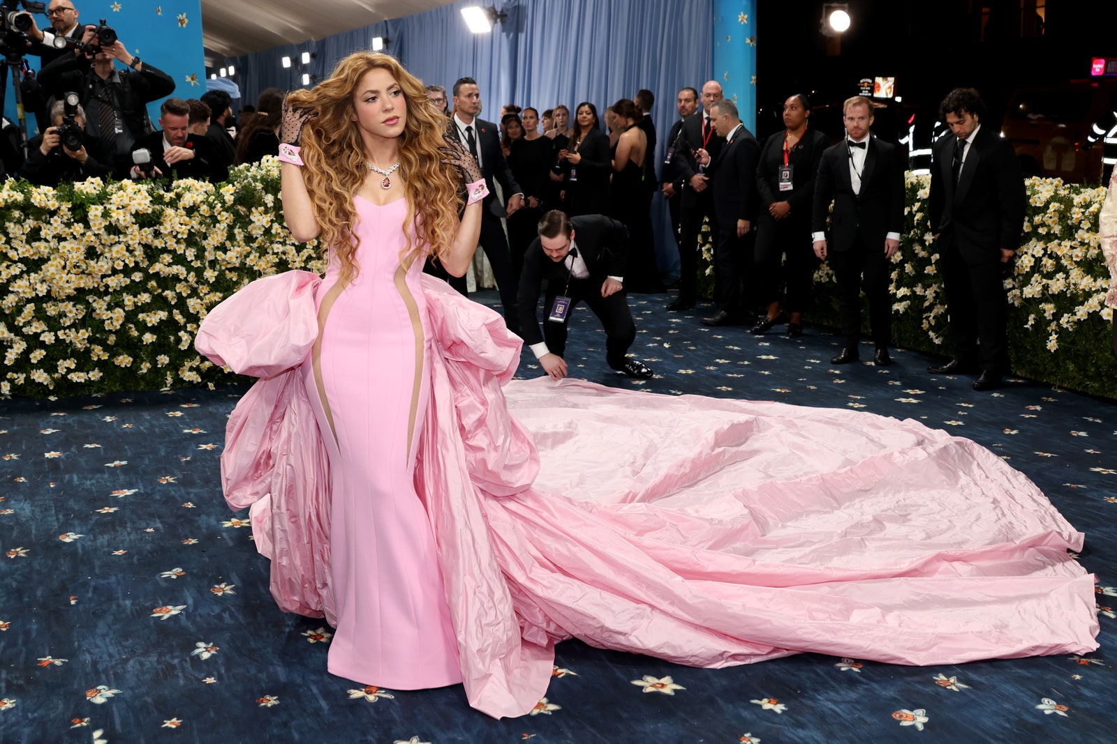 Images may contain Shakira clothing dresses, formally wearing stylish dresses adult accessories jewelry and necklaces