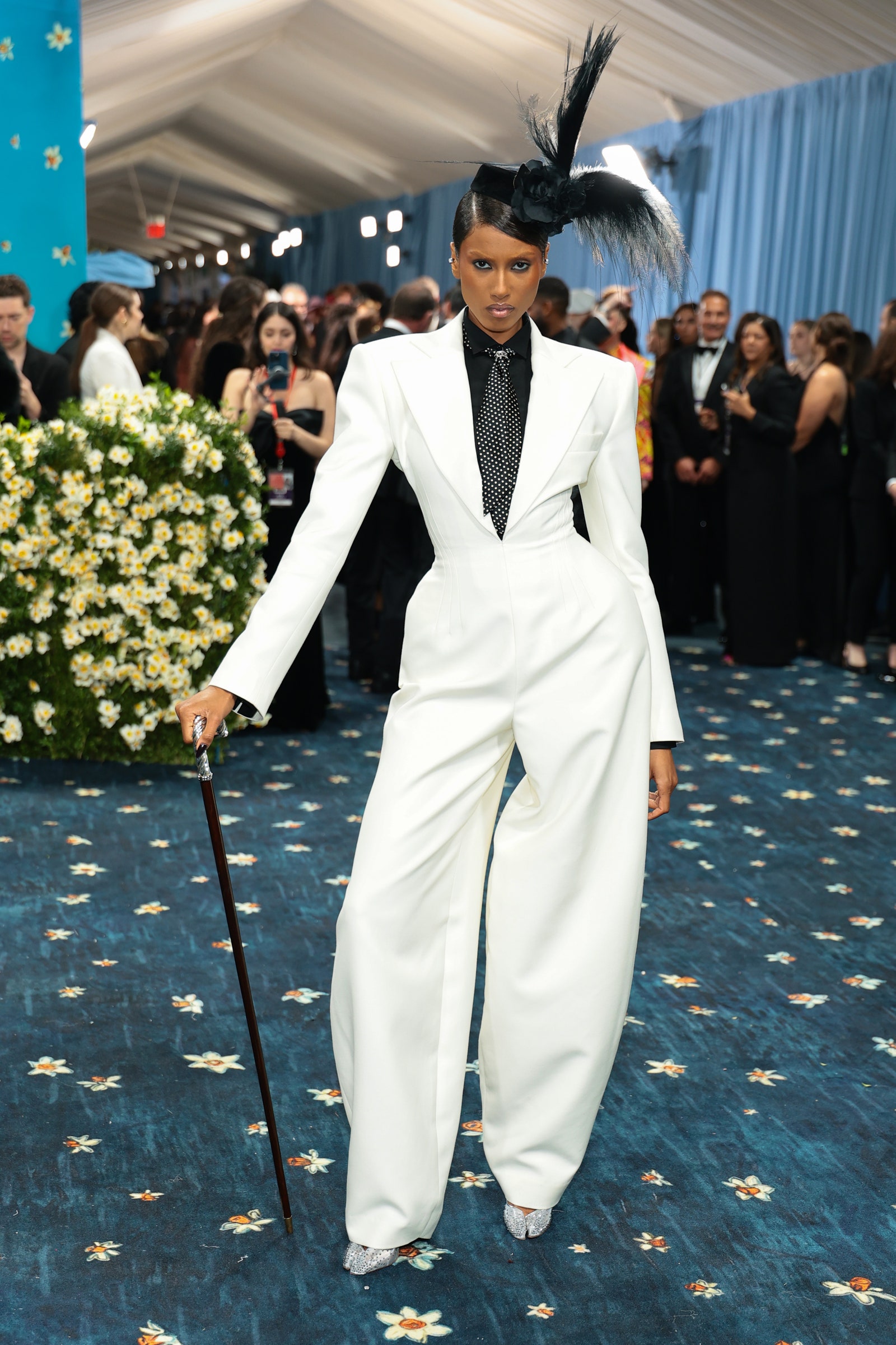 Images may contain Imaan Hammam Barbara Casasola clothing formal suit adult accessories tie and wedding