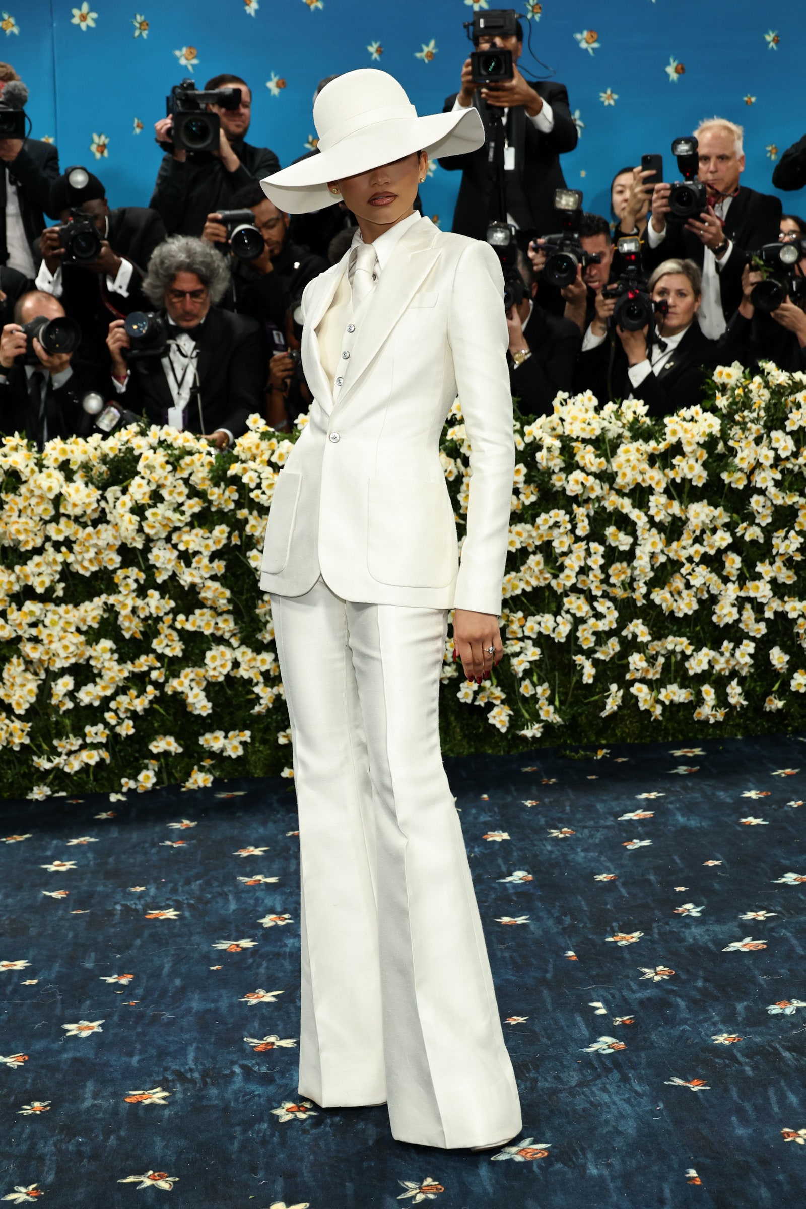 Images may contain Zendaya Besnik Hasi Gregory H. Johnson Yang Jun La Parka Man Cameral Electronics and Cloth