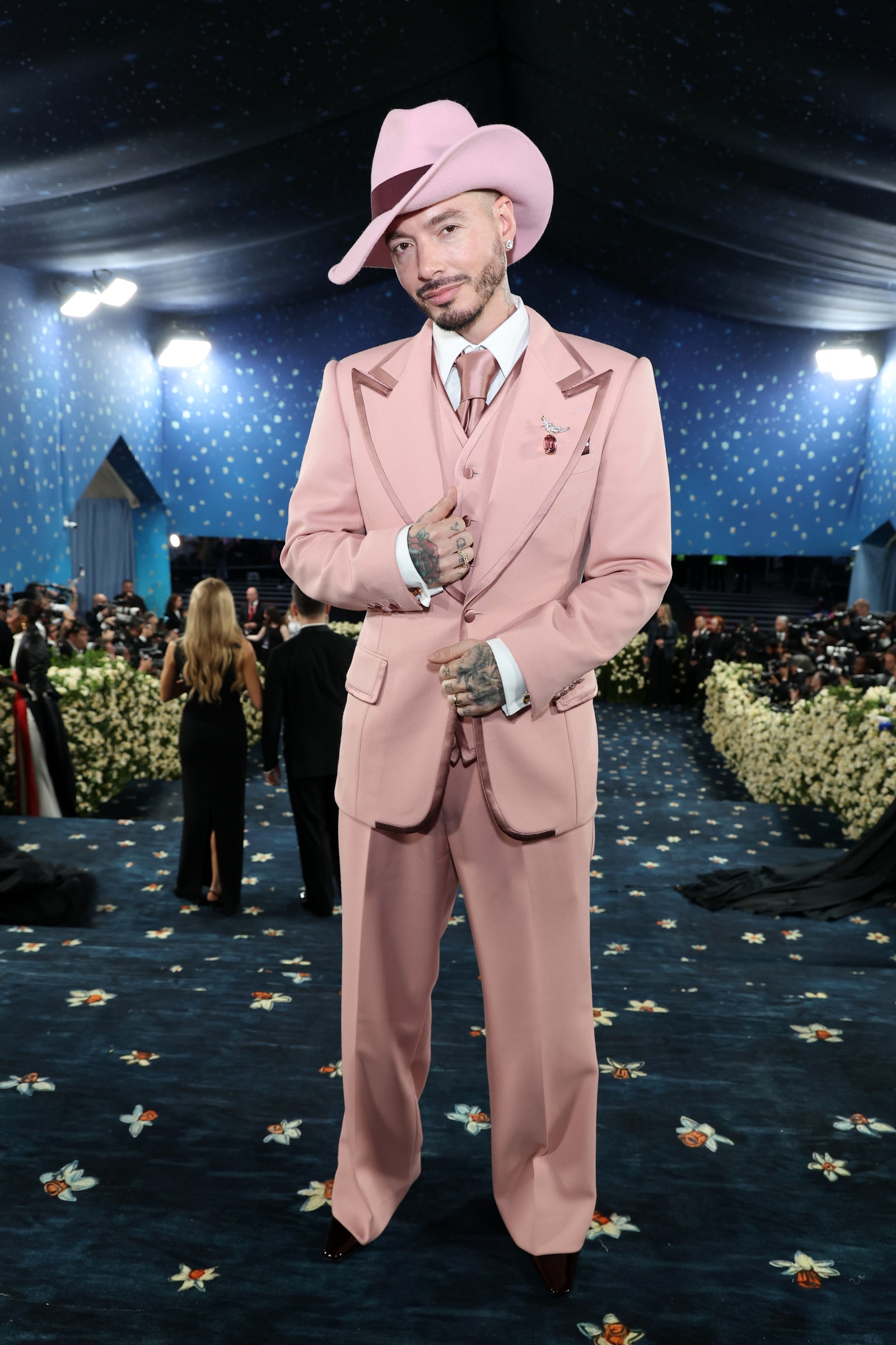 Images may contain J Balvin clothing formal clothing personnel adult hat accessories tie gloves and shoes