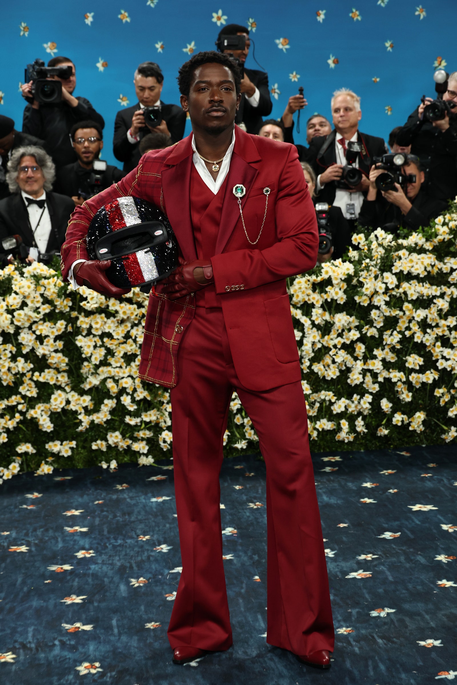 Images may contain Damson Idris Jason Worlds Gregory H. Johnson Wang Ning Helmet clothing gloves and accessories
