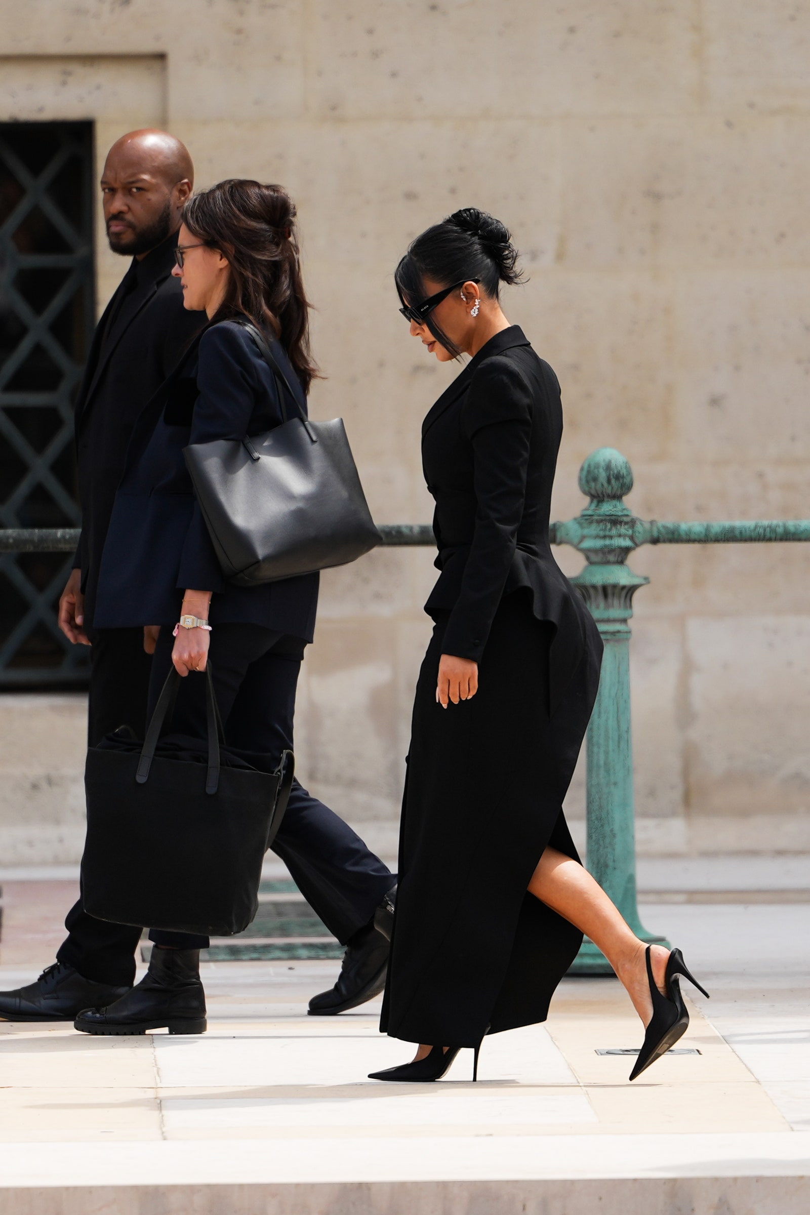 Images may contain clothing shoes, shoes, high heels, accessories bags, handbags, adult glasses and pedestrians