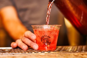 Bartender puts custom White Crow® vodka alcoholic beverage