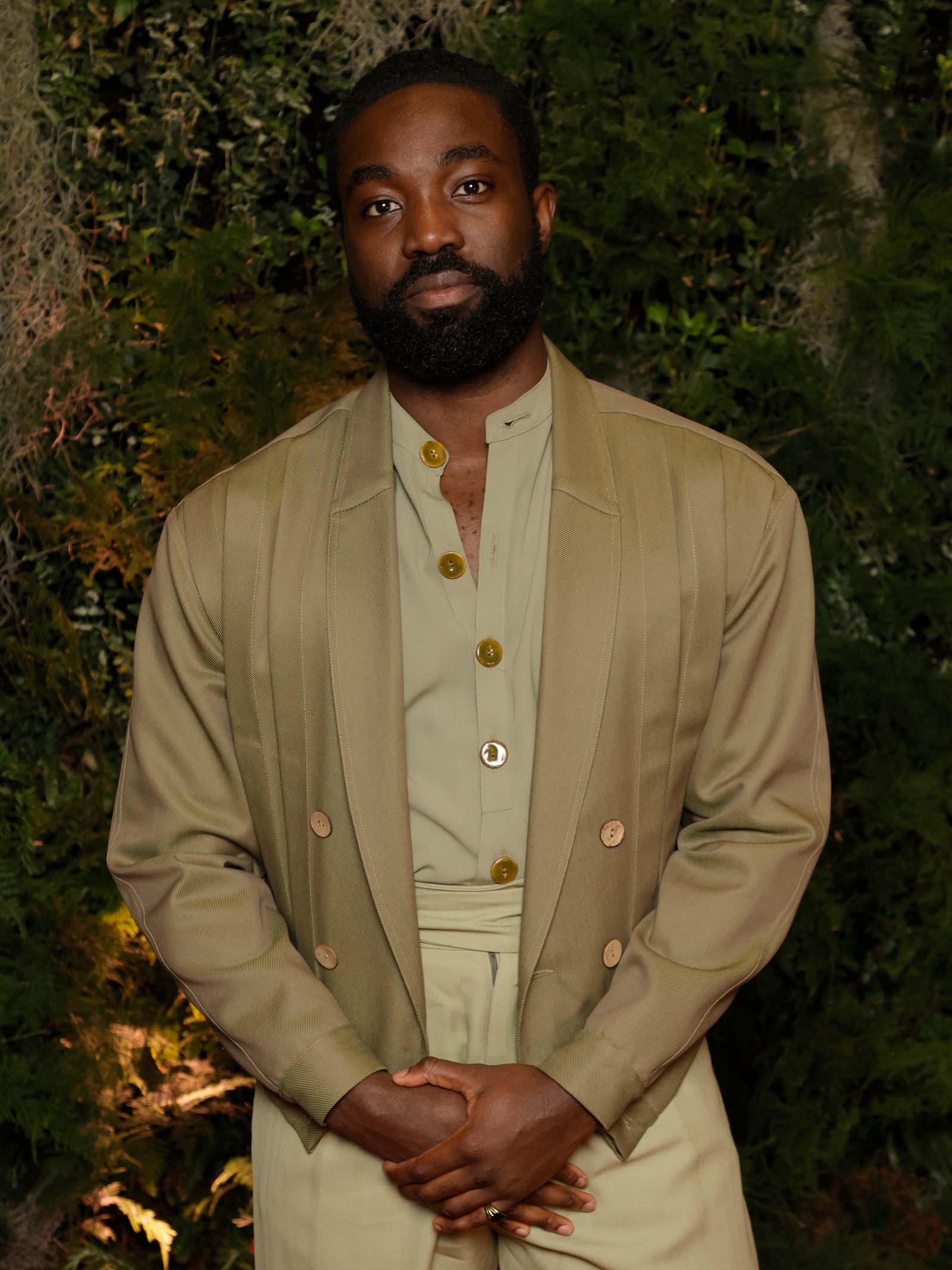 Images may contain paapa Essiedu blazer clothing blazer standing photography and portrait