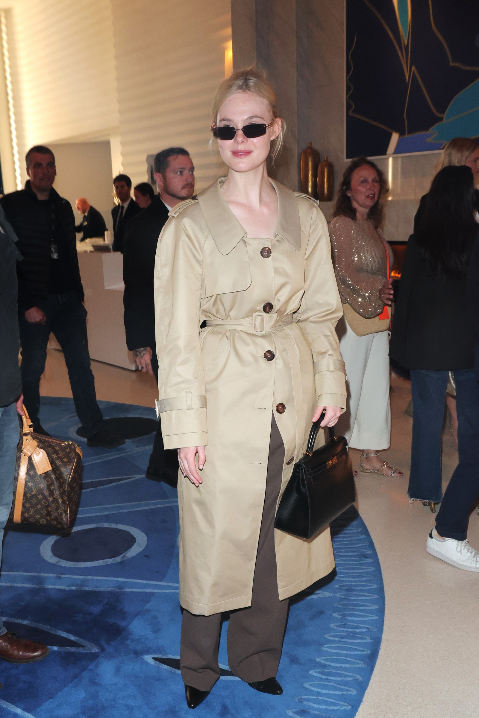 Images may contain Elle Fanning Kate Burton clothing shoes shoes tote bag handbag jacket and adult