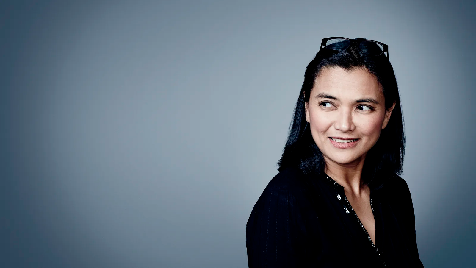 Image may contain Face Happy Head Person Smile Photography Portrait Black Hair Hair and Adult