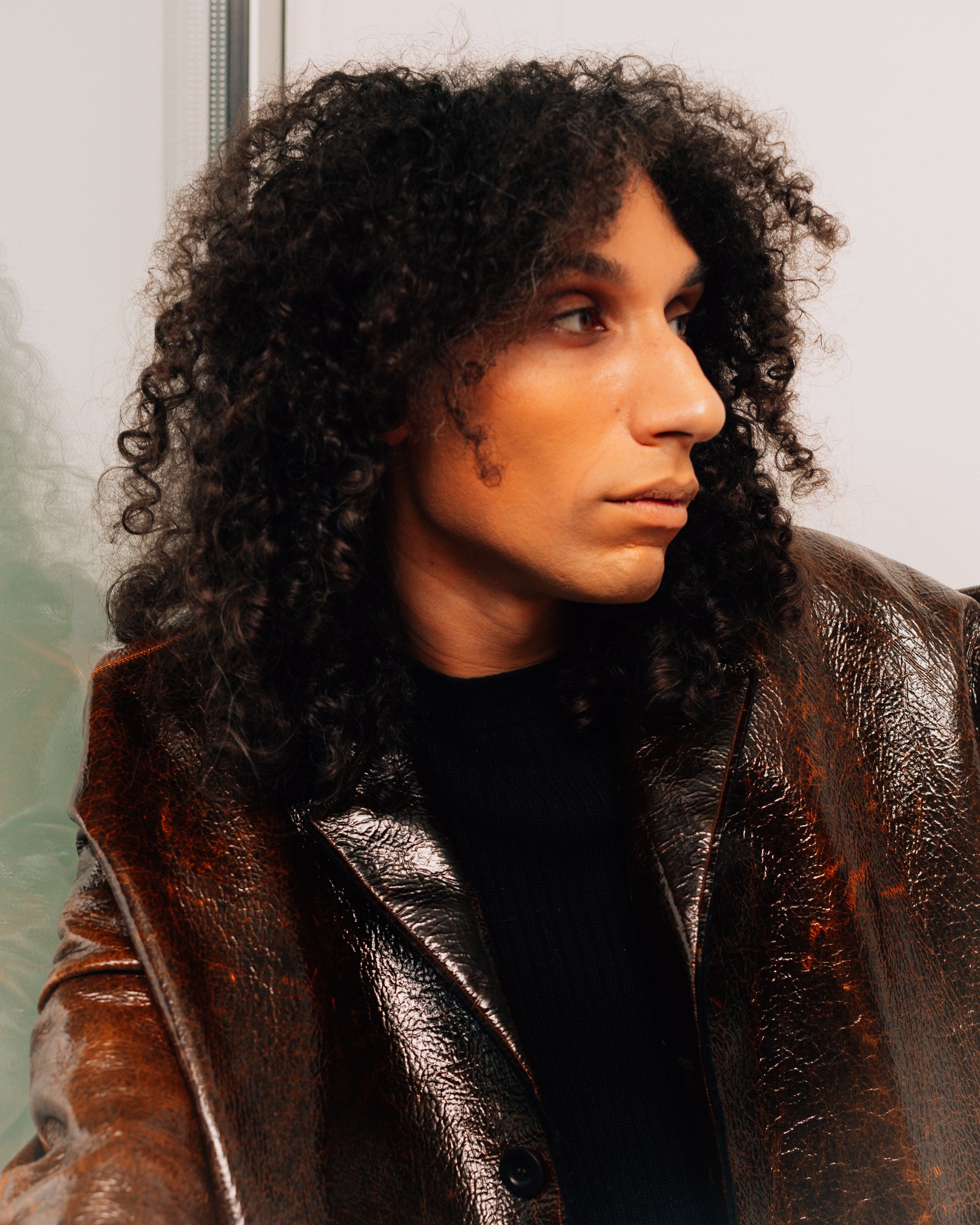 Image may contain Clothing Coat Jacket Adult Person Face Head Photography and Portrait