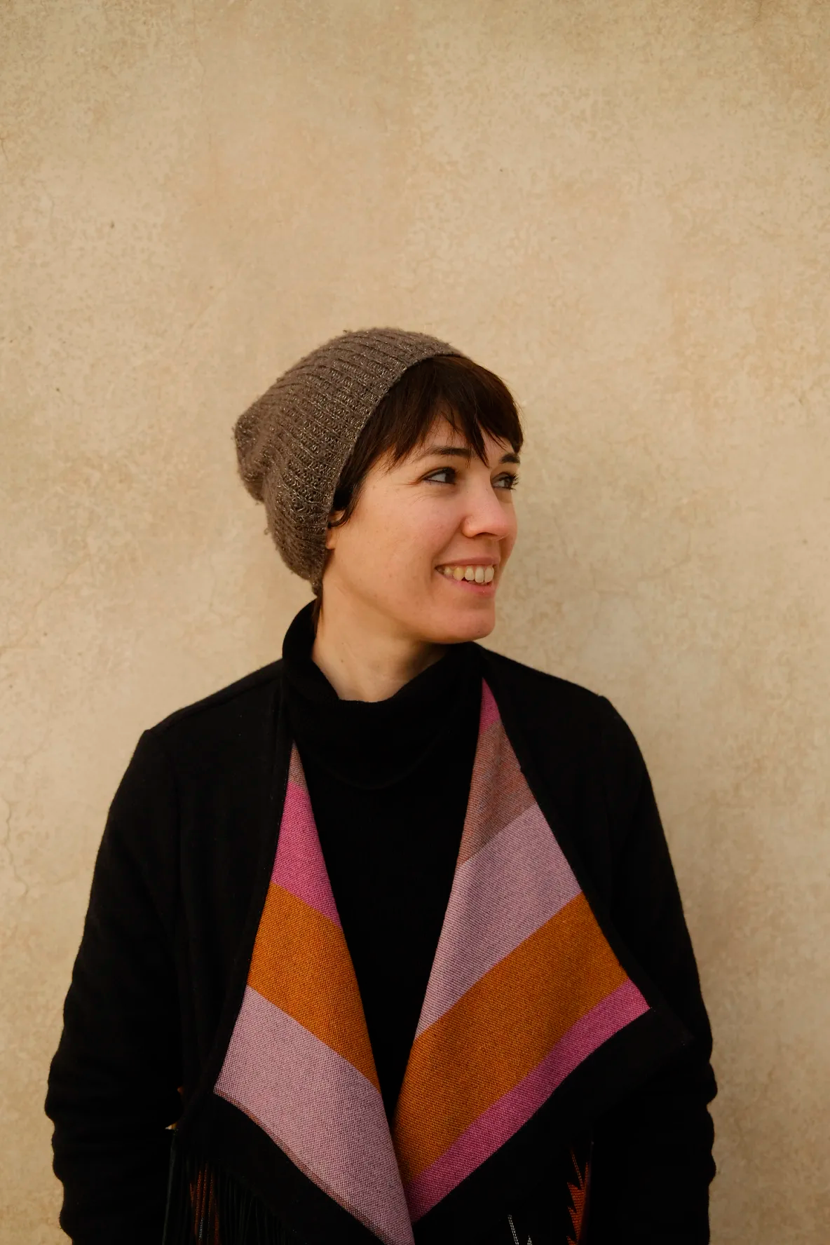 Image may contain Clothing Hat Cap Person Beanie Coat Face Head Photography and Portrait