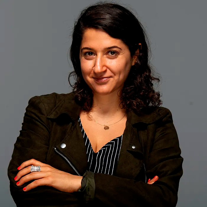 Image may contain Head Person Face Adult Happy Smile Black Hair Hair Photography Portrait Dimples and Clothing