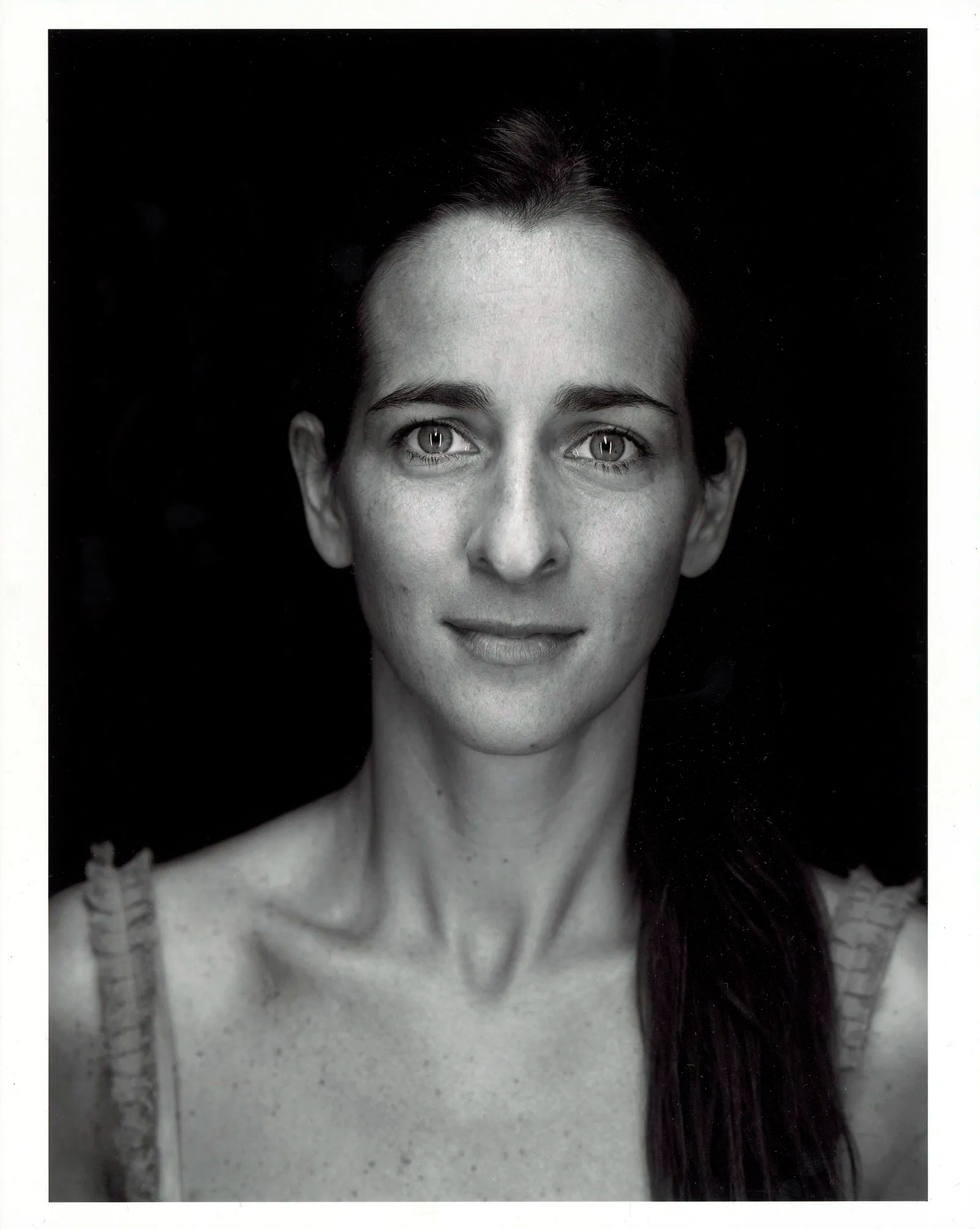Image may contain Face Head Person Photography Portrait Body Part Neck Happy Smile and Adult