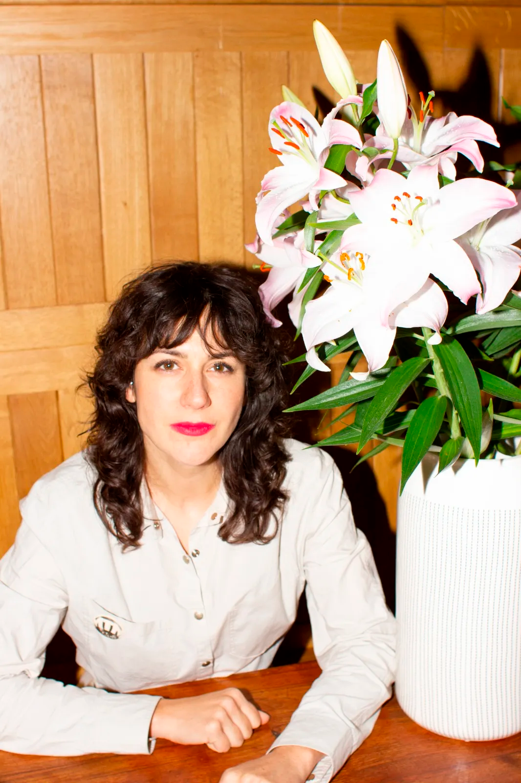 Image may contain Flower Flower Arrangement Plant Flower Bouquet Potted Plant Wood Face Head Person and Photography