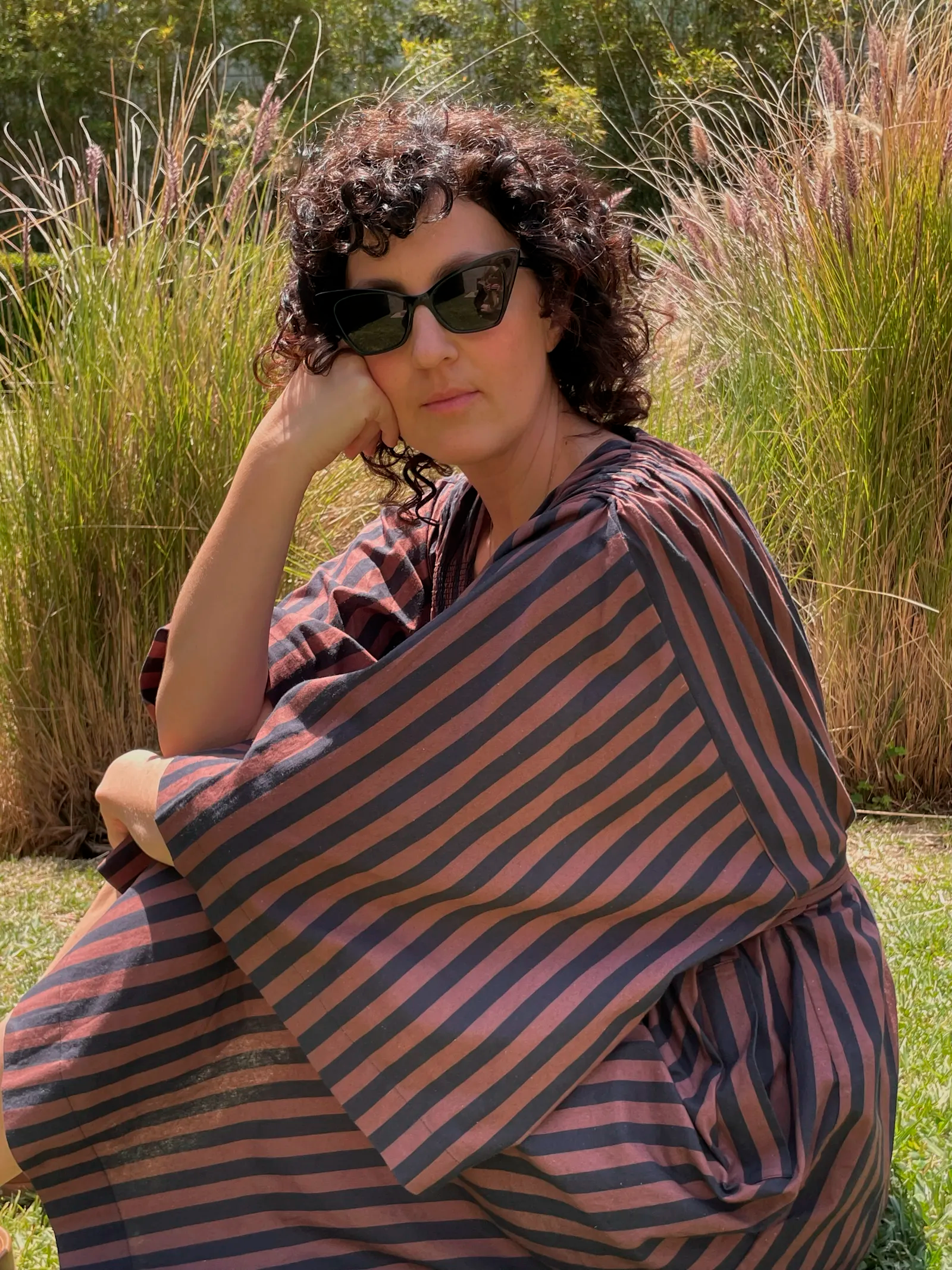 Image may contain Fashion Face Head Person Photography Portrait Clothing Dress Adult Accessories and Sunglasses
