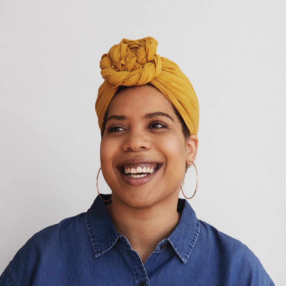 Image may contain Head Person Adult Face Happy Smile Clothing Turban and Dimples