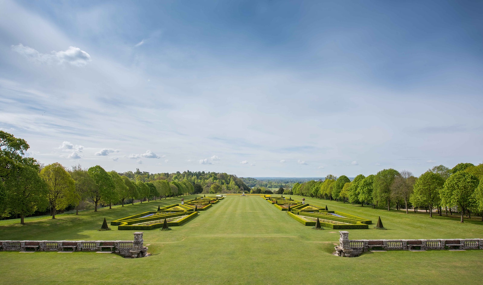 Images may contain grass, nature, outdoor park, plant landscape, lawn, buildings and cemeteries