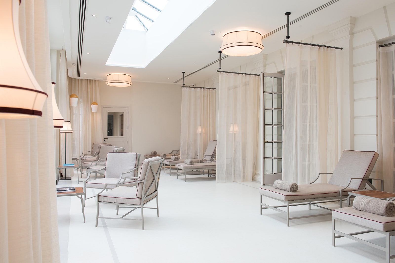 Images may contain indoor reception room waiting room buildings and light chair furniture in buildings