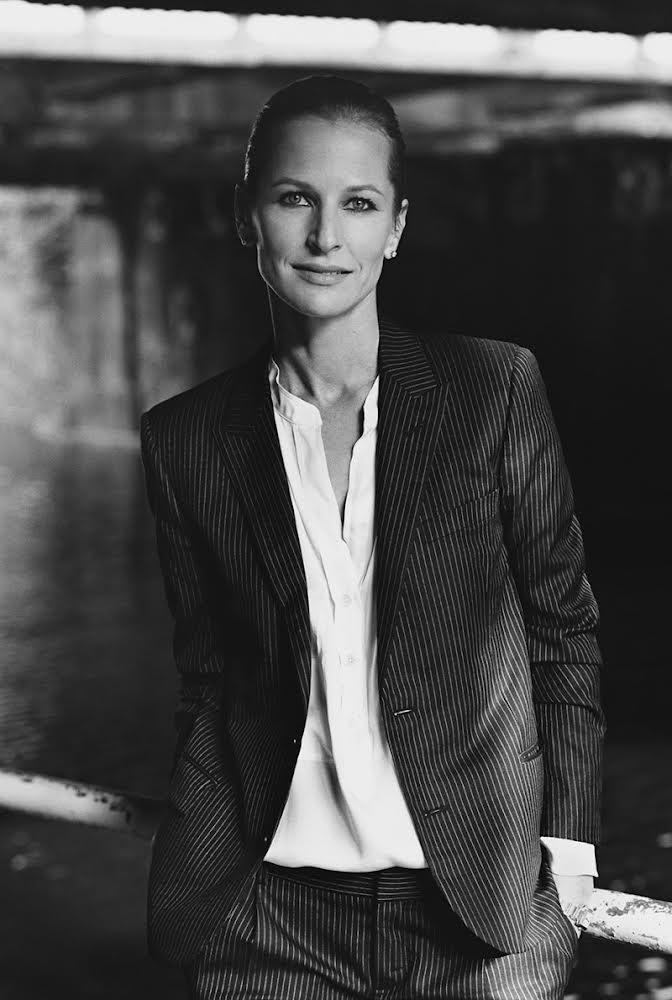 Image may contain Face Happy Head Person Smile Clothing Formal Wear Suit Photography Portrait Coat and Jacket