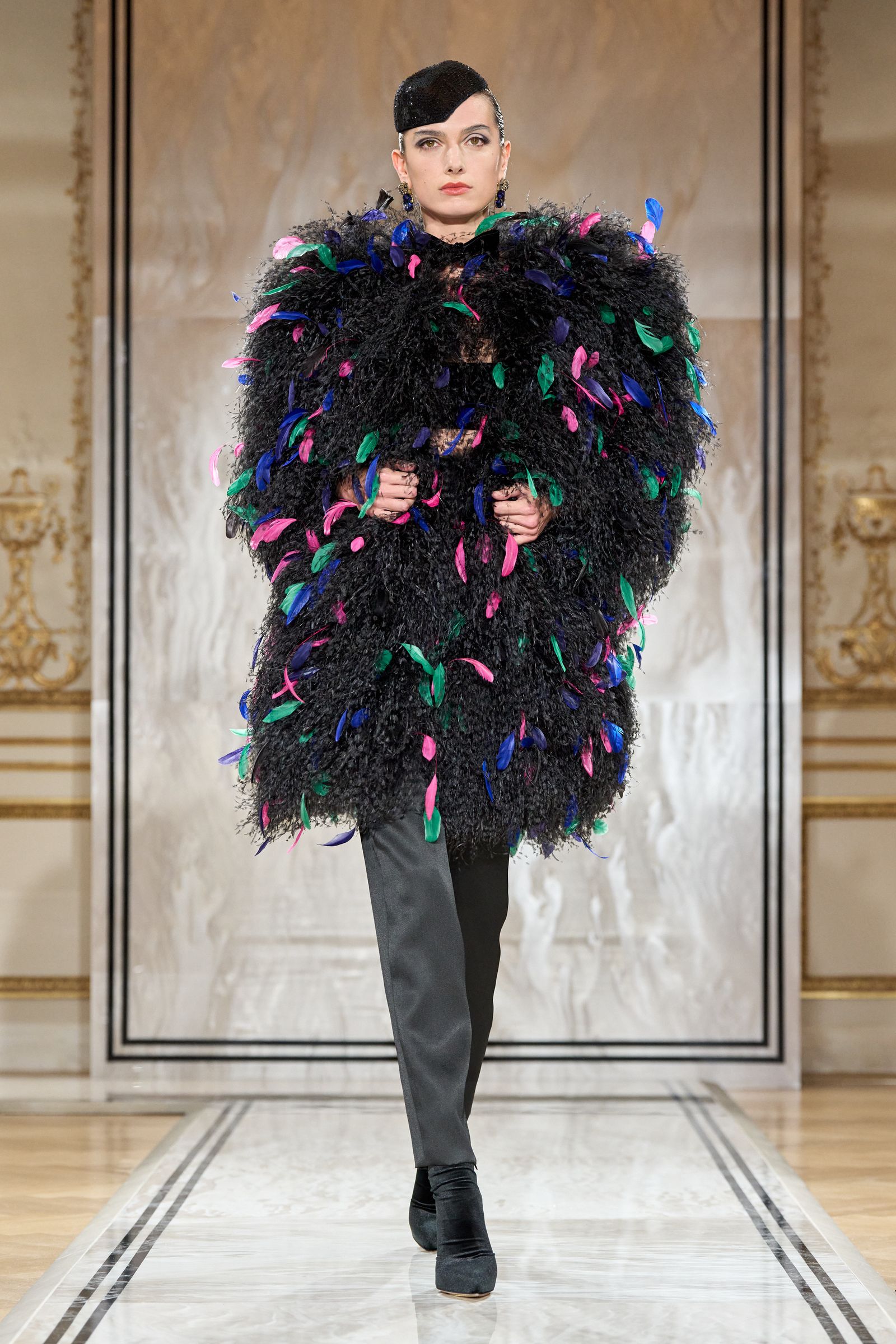 Images may contain cape costume adult fashion jackets and runways