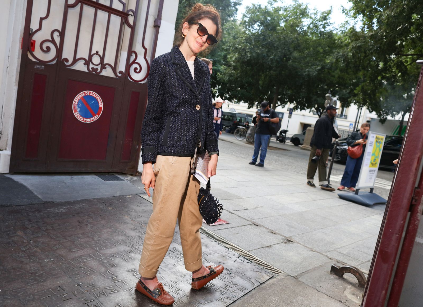 Images may contain clothes, pants, shoes, accessories bags, handbags, adult glasses and pedestrians