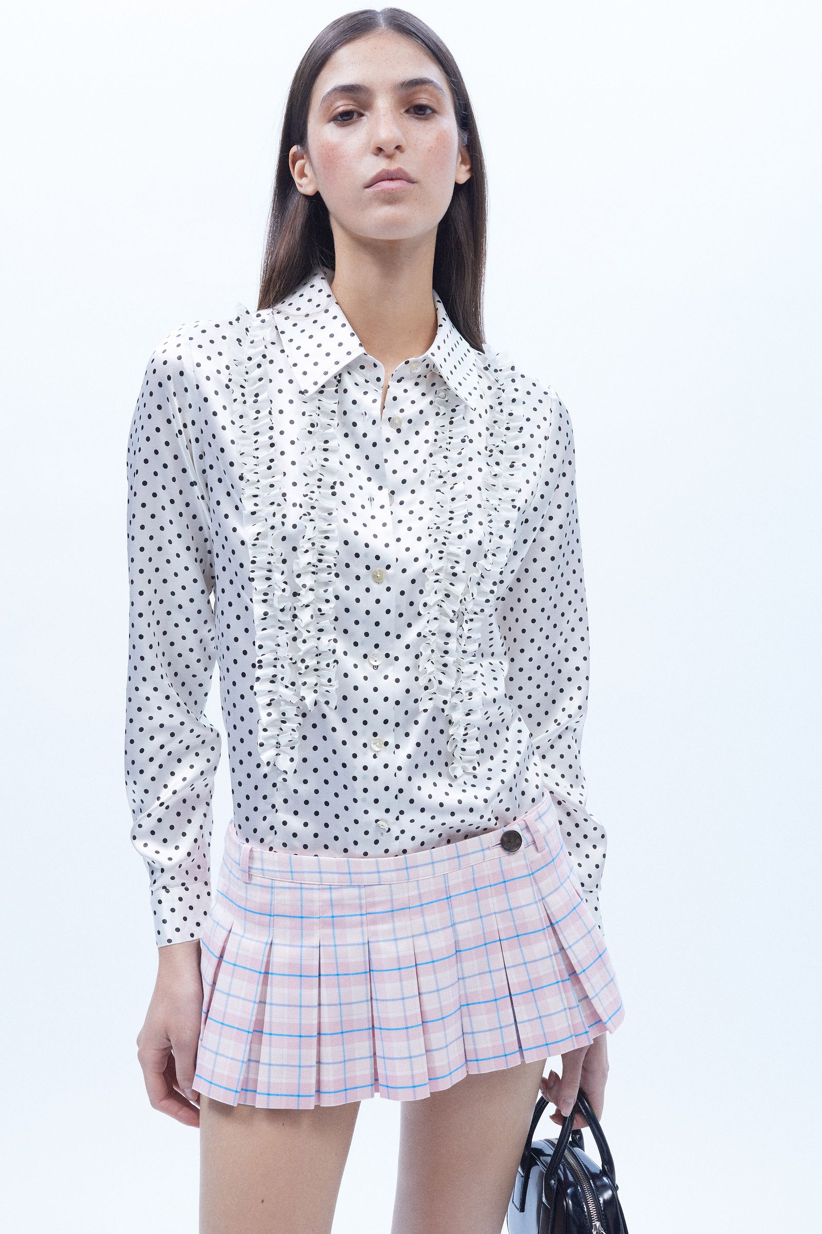 Images may contain top-notch clothes shirt skirt accessories tote bags for adults and people