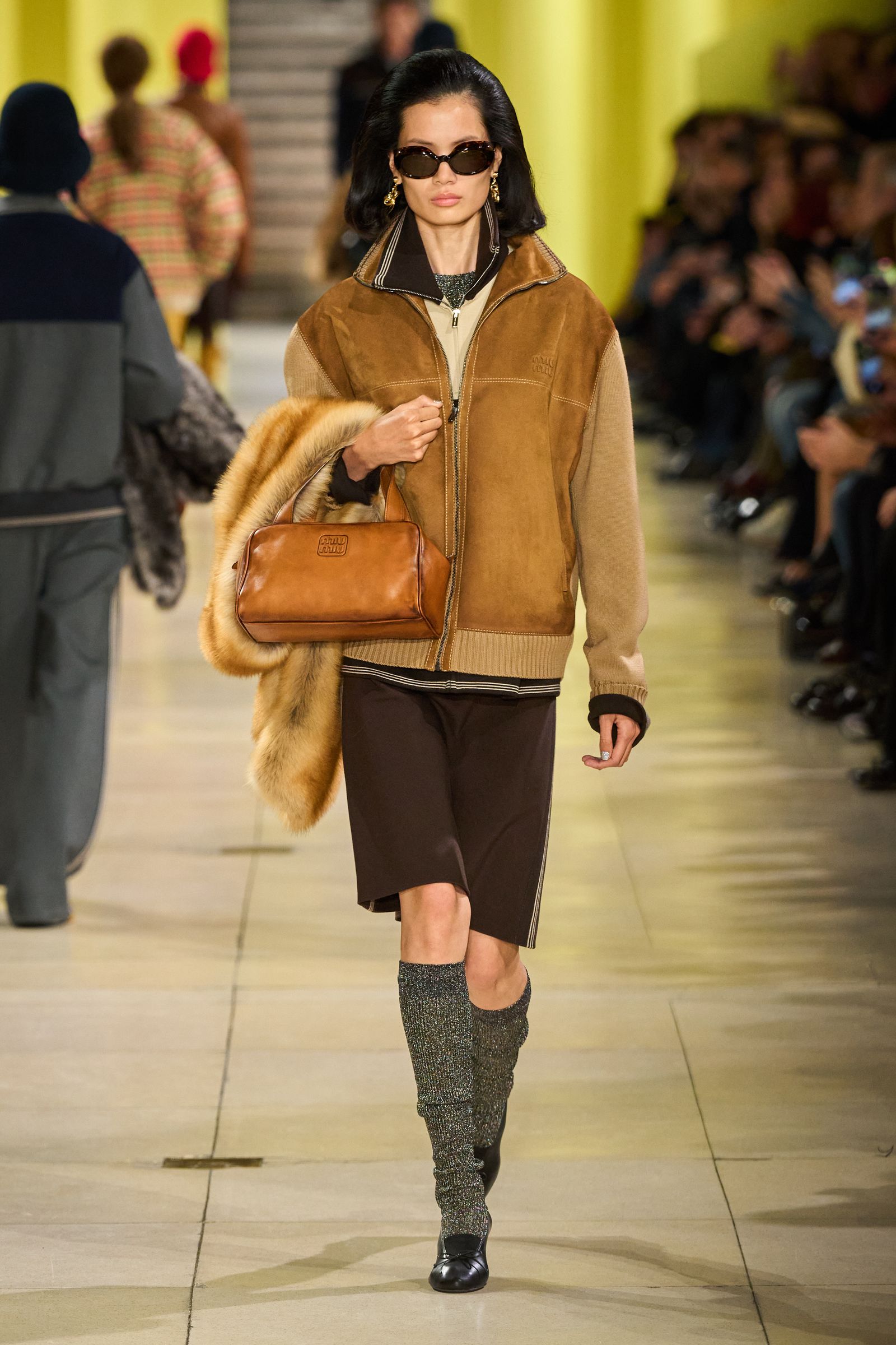 Images may contain accessories bags tote bags adult clothing jackets glass jackets gloves and shoes
