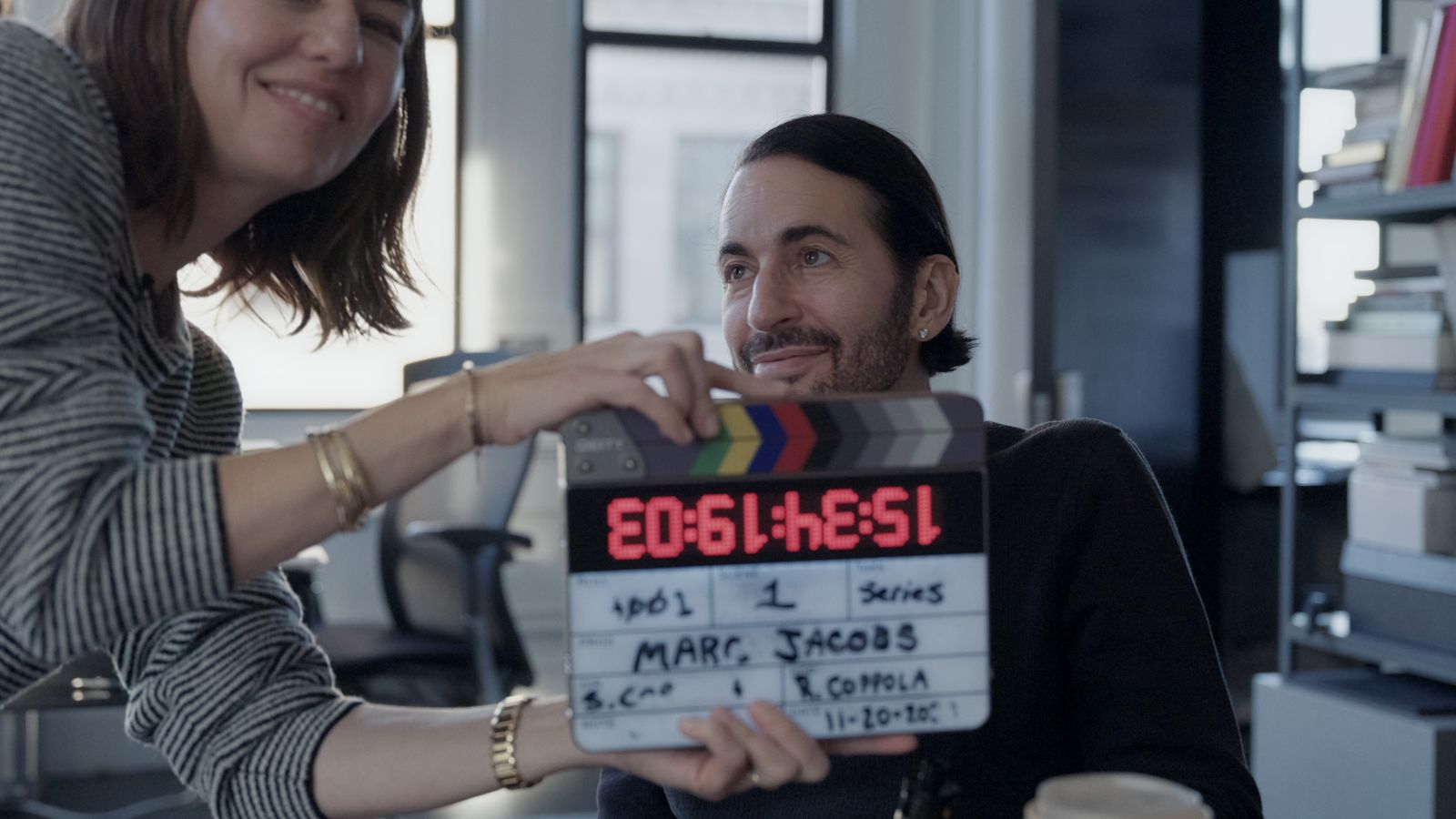 Images may contain Marc Jacobs Sofia Coppola adult head electronics screen facial text and clapper board