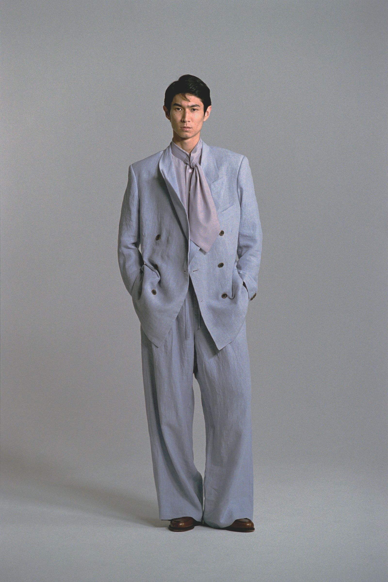 Images may contain formal clothing in blazer pants tuxedo adult home decor linen and footwear