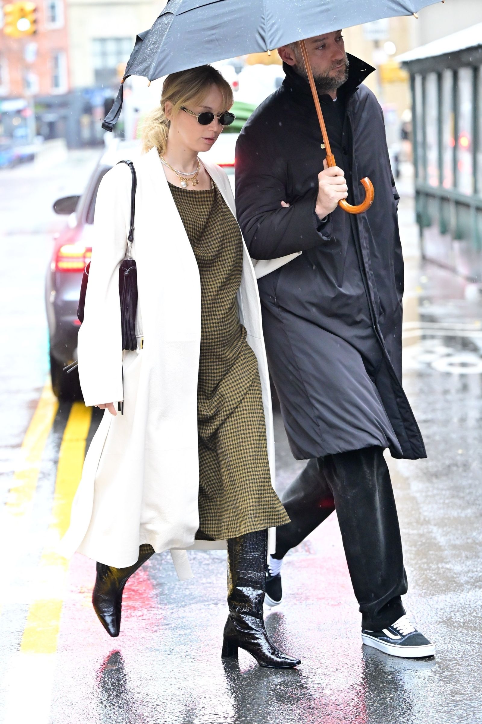 New York's exclusive glowing Jennifer Lawrence showed off her chic maternal style while out with her husband this morning...